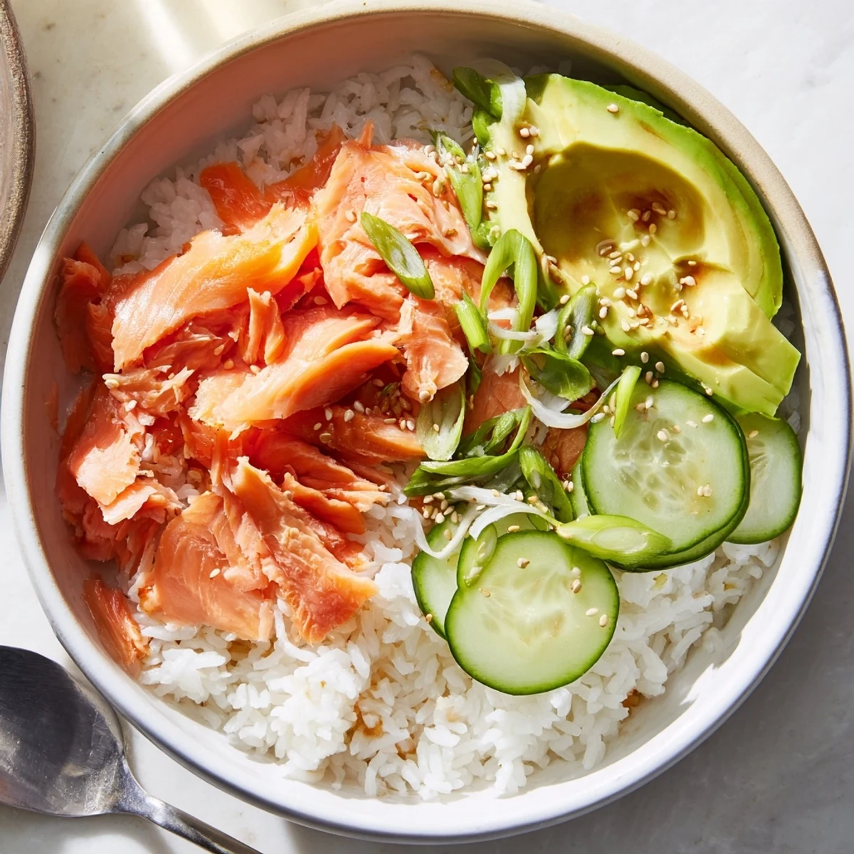Quick Leftover Salmon & Rice Bowl featuring vibrant toppings and savory flavors.  