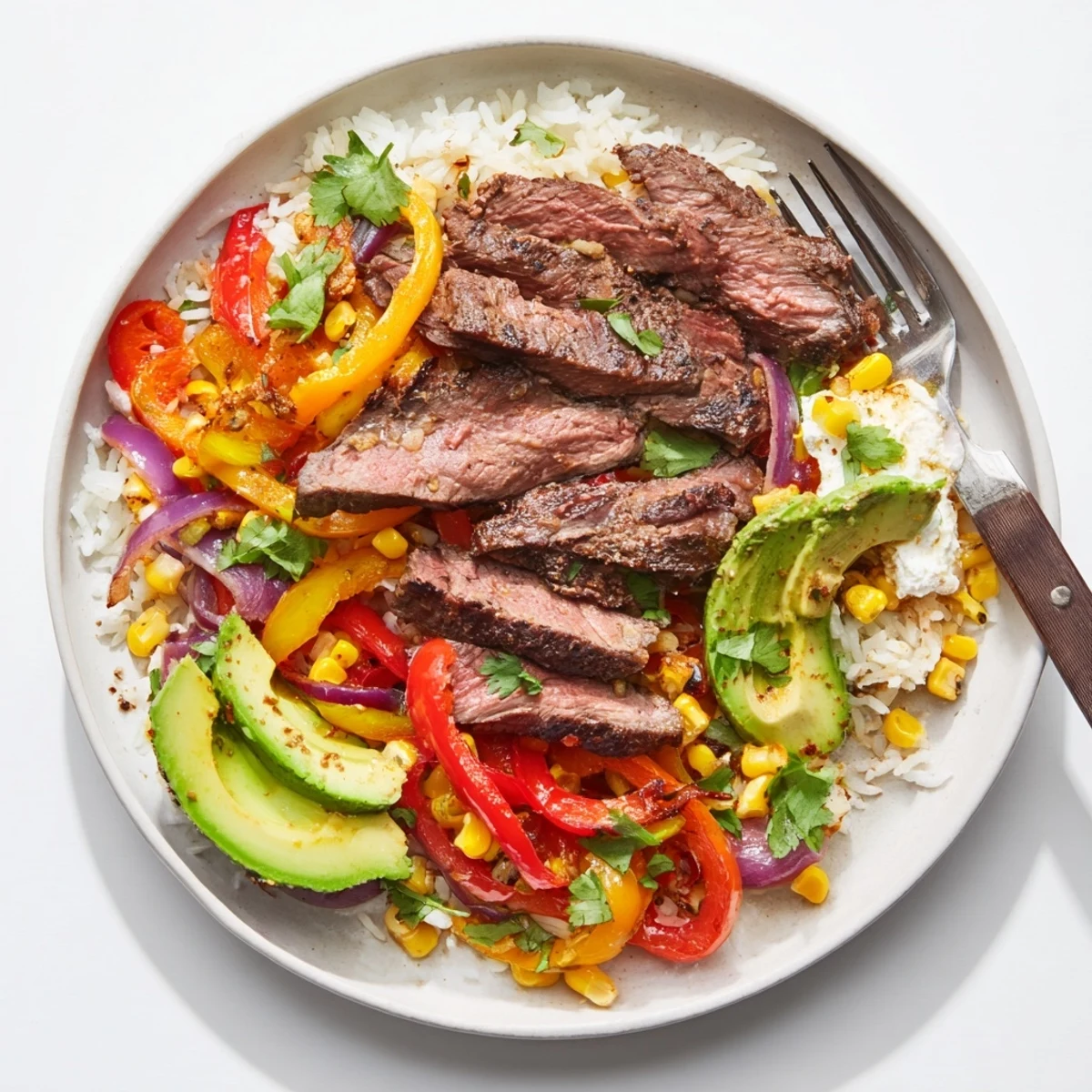 Smoky BBQ Steak Fajita Bowl with tender steak, colorful peppers, and fresh cilantro, ready to enjoy.