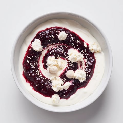 The Galaxy Spiral dessert: vibrant berry swirls with creamy yogurt, dotted with goat cheese.