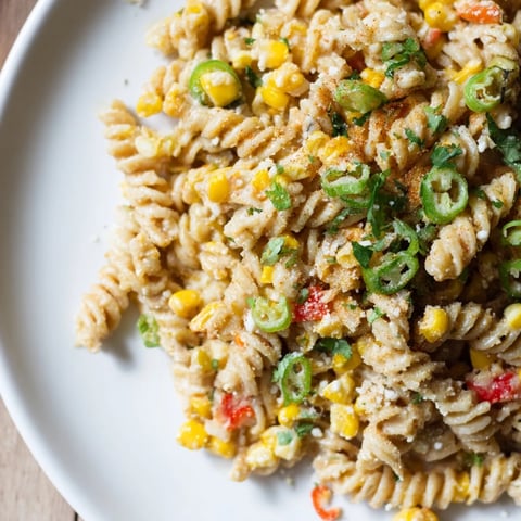 Creamy One-Pot Mexican Street Corn Pasta, with vibrant corn and crumbled cotija cheese.