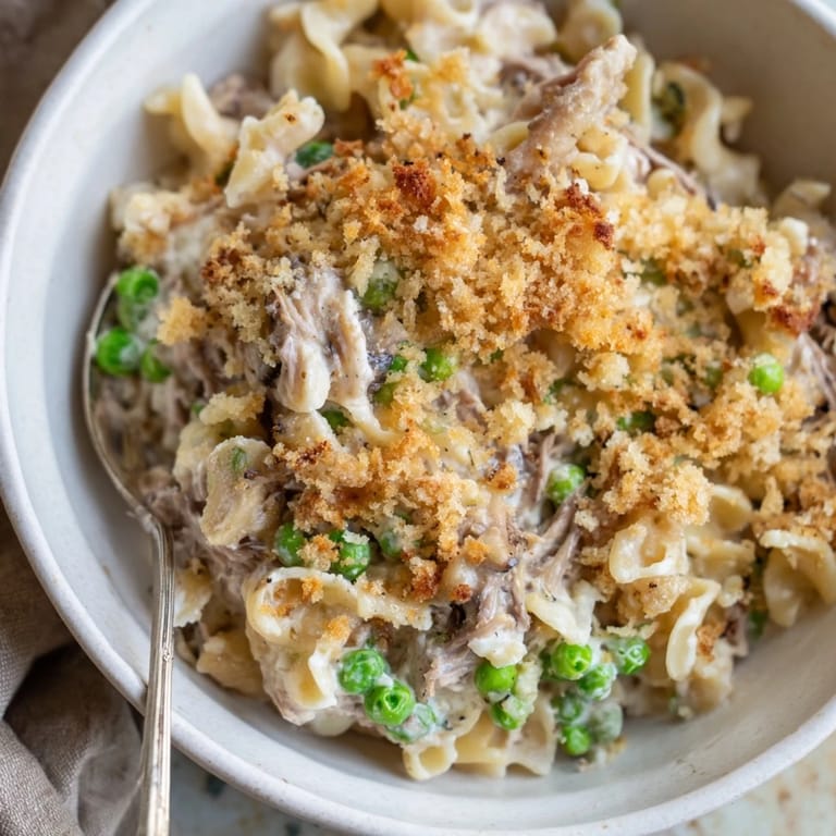 Savory Low-Cost Tuna Noodle Casserole featuring tender noodles and flaky tuna.  