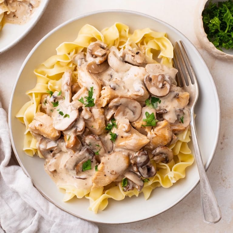 Indulge in this creamy Chicken Stroganoff highlighting tender chicken in rich sauce.
